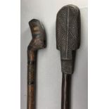 **A CARVED AUSTRALASIAN CLUB AND A CARVED AXE HAFT, LATE 19TH/20TH CENTURY