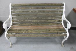 A cast iron wooden slatted garden bench