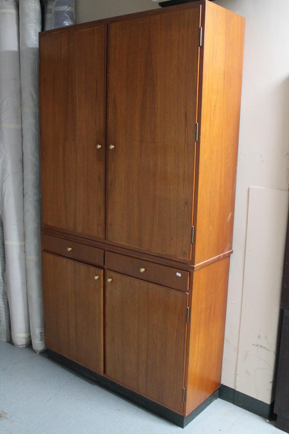 A teak double door cupboard