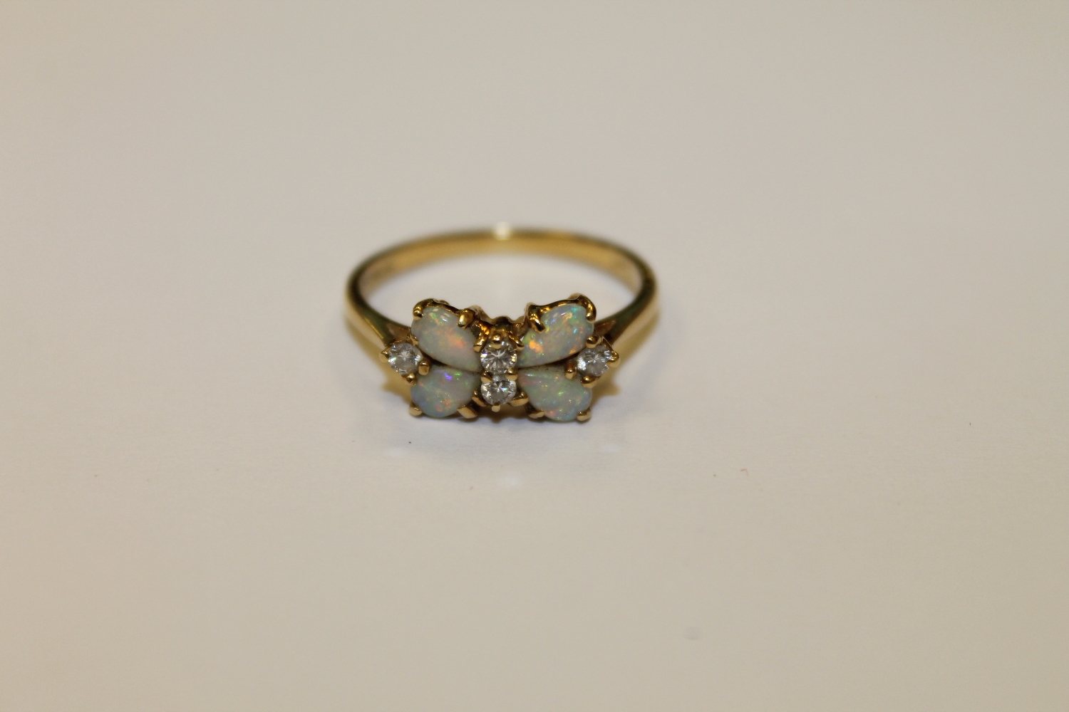 An 18ct gold opal and diamond ring