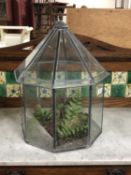 A leaded glass terrarium with cover,