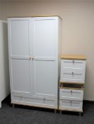 A contemporary white double wardrobe together with a pair of two drawer bedside chests