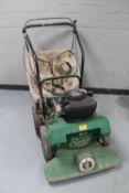 A Briggs & Stratton petrol self propelled garden vacuum