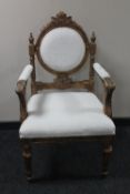 A gilt wood white brocade armchair