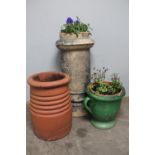 Two Victorian chimney pots together with a glazed pottery planter