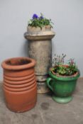 Two Victorian chimney pots together with a glazed pottery planter