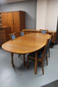 A seven piece late 20th century teak Nathan dining room suite