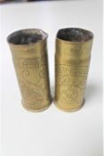 A pair of brass trench art military shells