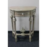 A reproduction demi lune hall table