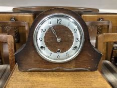 An Edwardian oak mantel clock