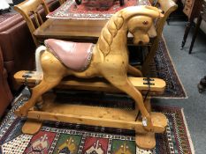 A carved pine rocking horse,