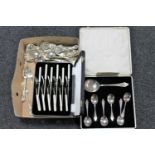 A tray of cased and un-cased cutlery