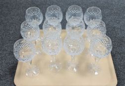 A set of twelve cut crystal champagne glasses