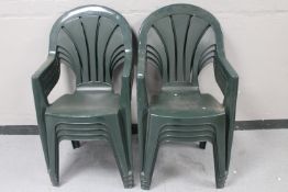 Eight plastic stacking garden chairs