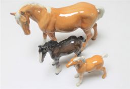 Three Beswick figures : Palomino horse and foal,