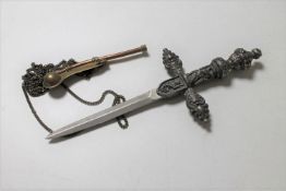 A small ceremonial dagger and a boson's whistle