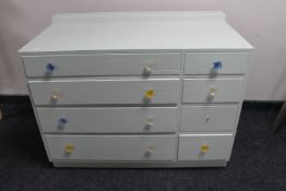 A mid century painted eight drawer chest