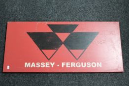A hand-painted metal sign 'Massey Ferguson'