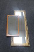 A gilt framed bevelled hall mirror together with a 1970's teak framed mirror