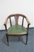 An Edwardian stained beech desk armchair with green leather seat