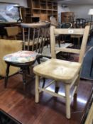 A spindle back kitchen chair and another chair
