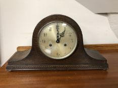 An Edwardian oak mantel clock