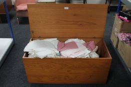 A 20th century S Form Sutcliffe Todmorden teak blanket box containing bedding