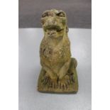 A weathered concrete garden figure of a Griffin,