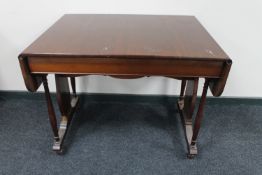 An early 20th century mahogany flap sided sofa table