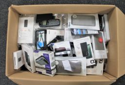 A large box of electrical items, old mobile telephone hand sets, phone covers,