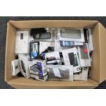 A large box of electrical items, old mobile telephone hand sets, phone covers,