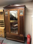 A late Victorian mahogany mirror door wardrobe,