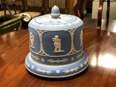 A 19th century blue and white Jasperware cheese dome and stand