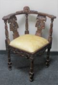 A reproduction mahogany corner armchair