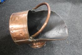 A Victorian copper coal helmet