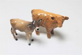 Two Beswick calves : Jersey and Highland