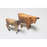 Two Beswick calves : Jersey and Highland