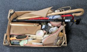 A box of dressing table items, brushes, walking sticks,