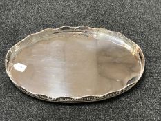 A silver plated twin handled gallery tray width 61 cm.
