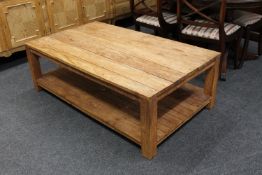 A rustic pine two tier coffee table