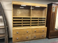 A mid century haberdashery cabinet,