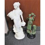 A painted chalk figure - female with basket together with a further painted composite figure -