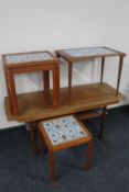 A mid century teak coffee table with undershelf together with a nest of two Danish teak tiled