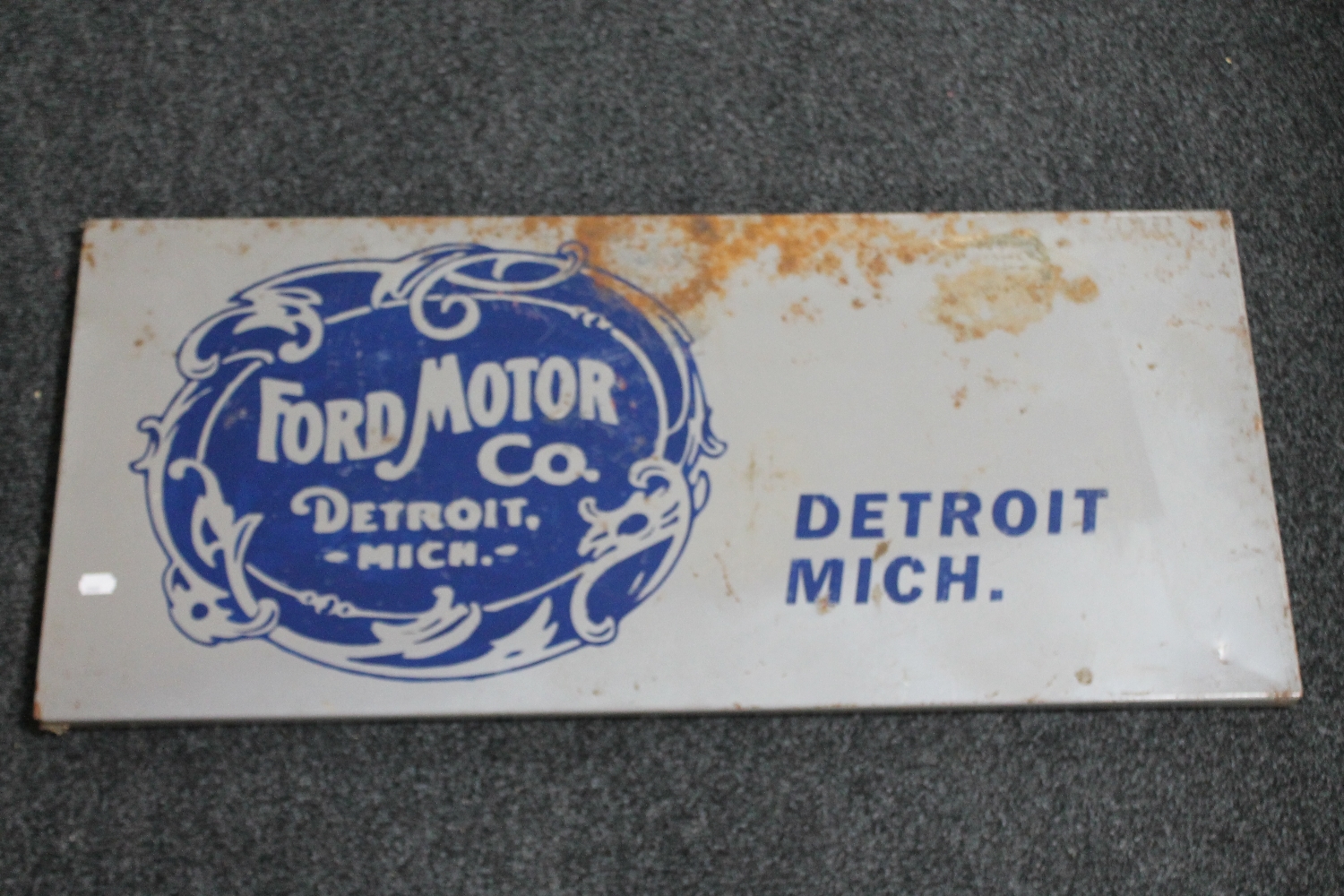 A reproduction enamelled metal sign 'Ford Motor Company Detroit,