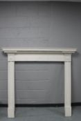 A 19th century painted pine fire surround