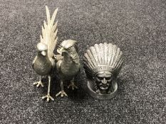 A pair of metal bird ornaments together with a Guy Motor's Ltd American mascot figure