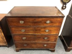 A George III mahogany four drawer chest on bracket feet,