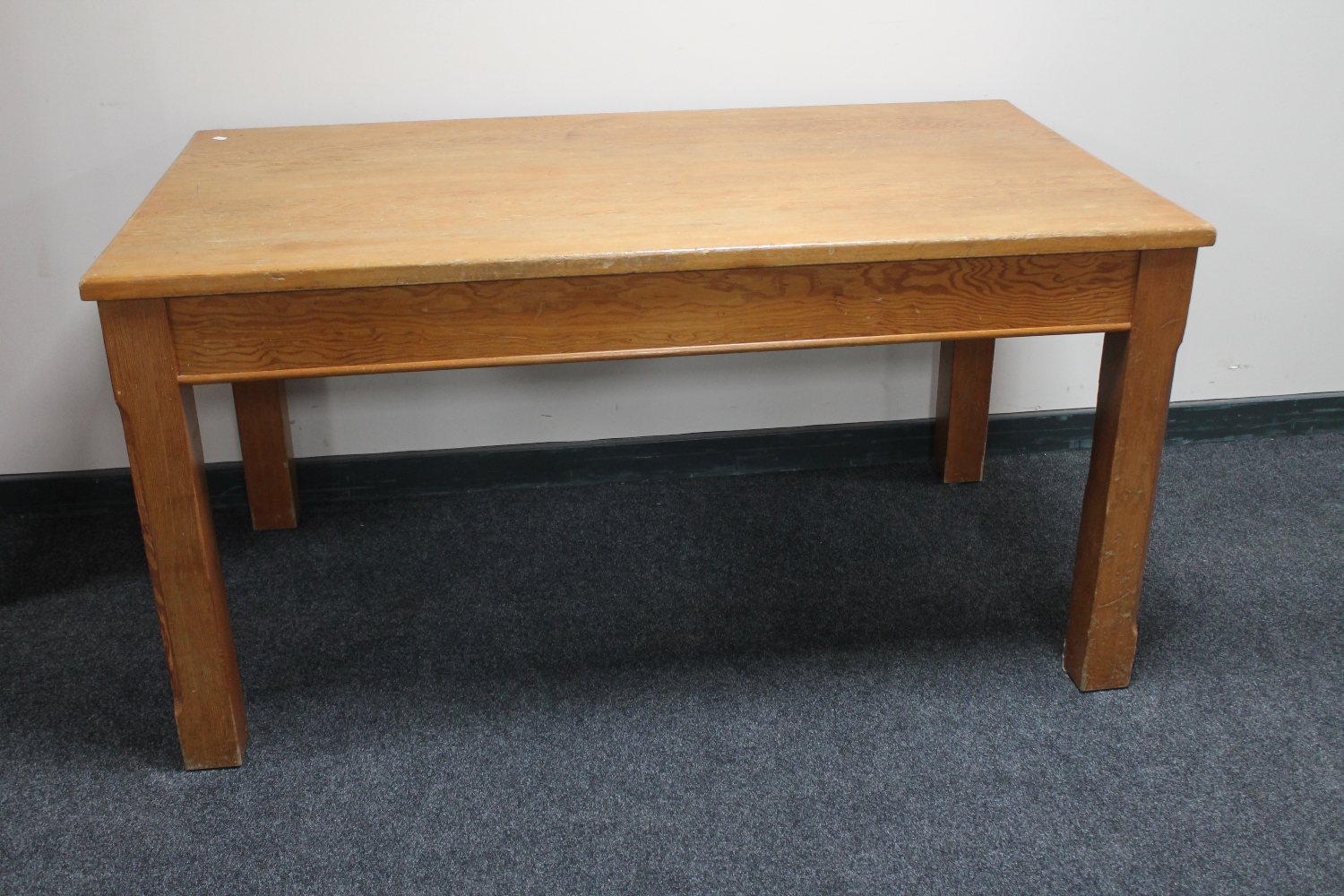 An early 20th century pine kitchen table