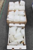 Three boxes and a bag of plastic fuel mixing bottles