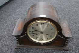 An Edwardian oak mantel clock